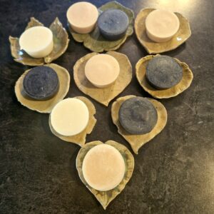 Heart Shaped arrangement of Fatglow NZ face soaps on handcrafted pottery soap dishes arranged in a heart shape