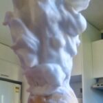 Lather from Fatglow Tallow Shave Soap on a shaving brush, showing rich creamy texture and natural soap colour
