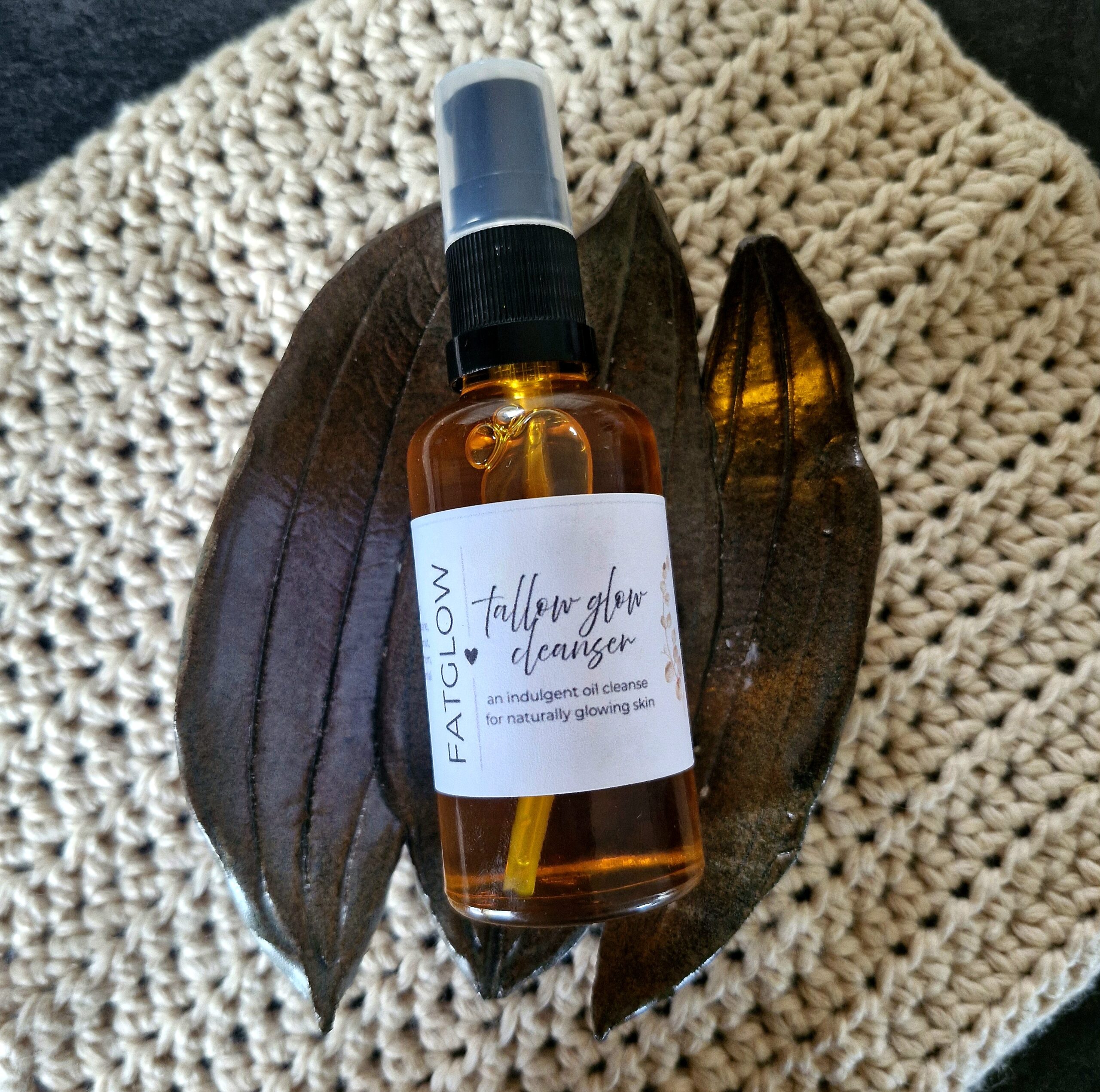 Tallow Glow Cleanser sitting in a pottery soap dish, handmade in New Zealand by Fatglow