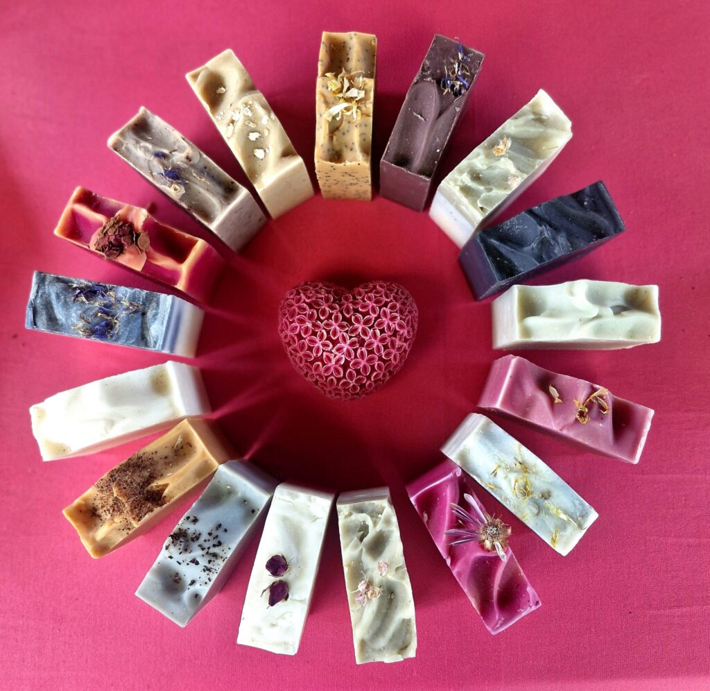 Arrangement of Tallow soap by Fatglow, arranged in a circle, showcasing the beautiful natural colours from botanicals and clays, handmade in New Zealand