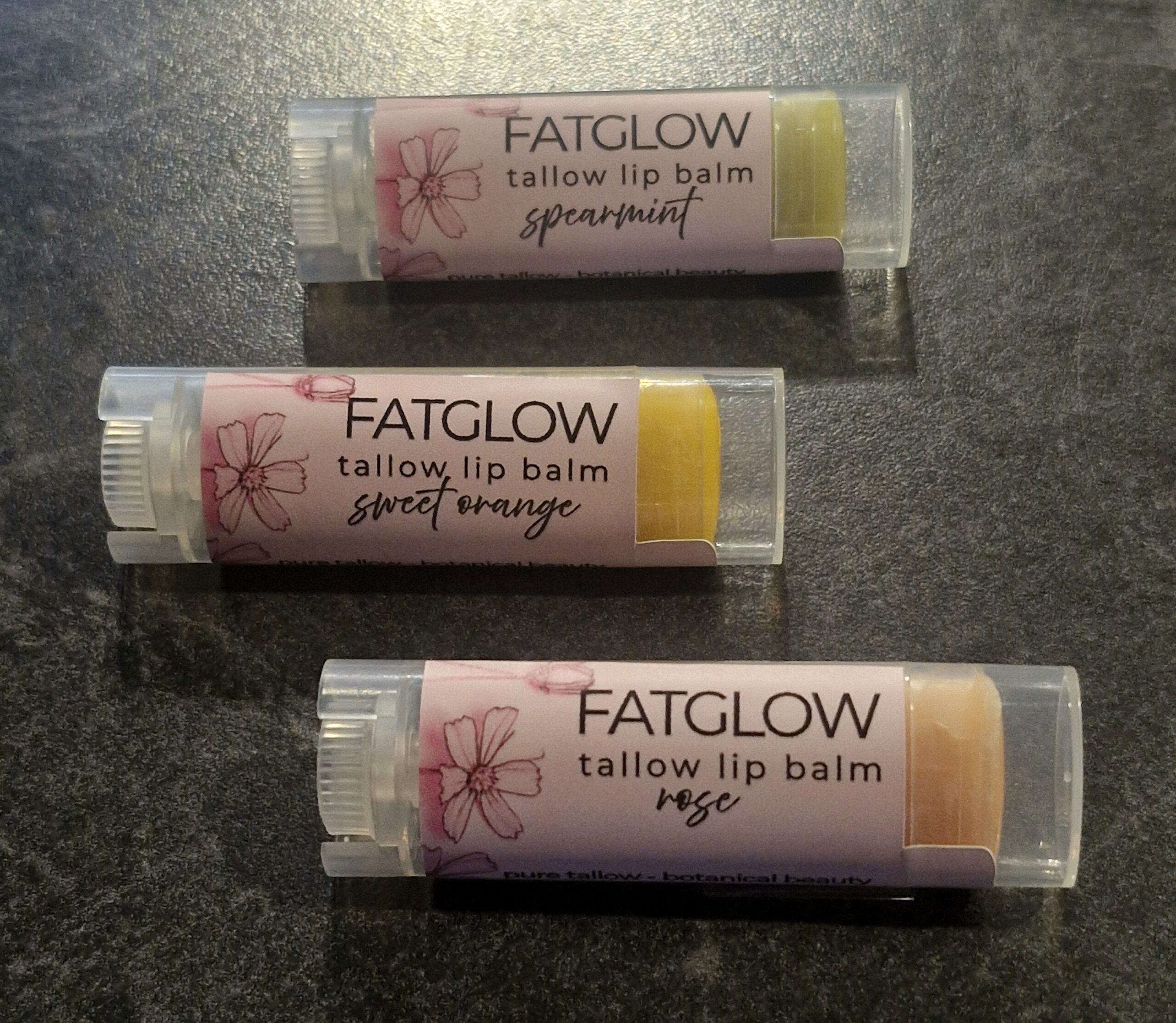 Fatglow Botanical Lip Collection — Sweet Orange Annatto, Rose Alkanet and Spearmint Spirulina grass-fed tallow lip balms, naturally infused botanical lip treatments handmade in New Zealand