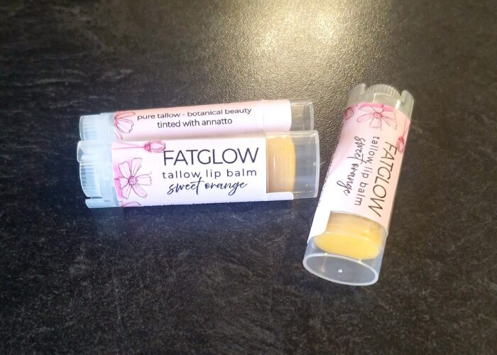 Fatglow Sweet Orange and Annatto infused grass-fed tallow lip balm — a natural botanical lip treatment handmade in New Zealand