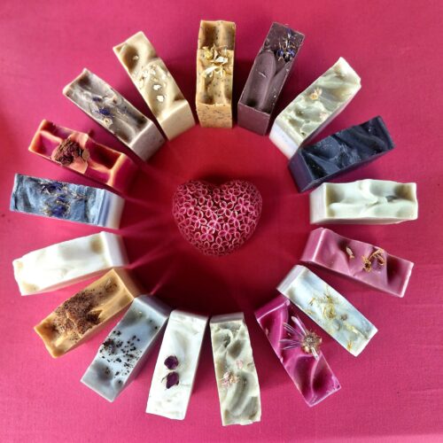 Arrangement of Tallow soap by Fatglow, arranged in a circle, showcasing the beautiful natural colours from botanicals and clays, handmade in New Zealand
