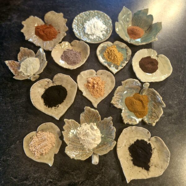 Clays and Botanicals displayed in handmade pottery soap dishes - Fatglow NZ