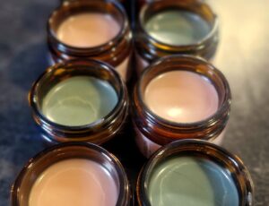 Fresh batches of Blue Tansy Glow Cream and St John's Wort Tallow Balm, setting before their final touches